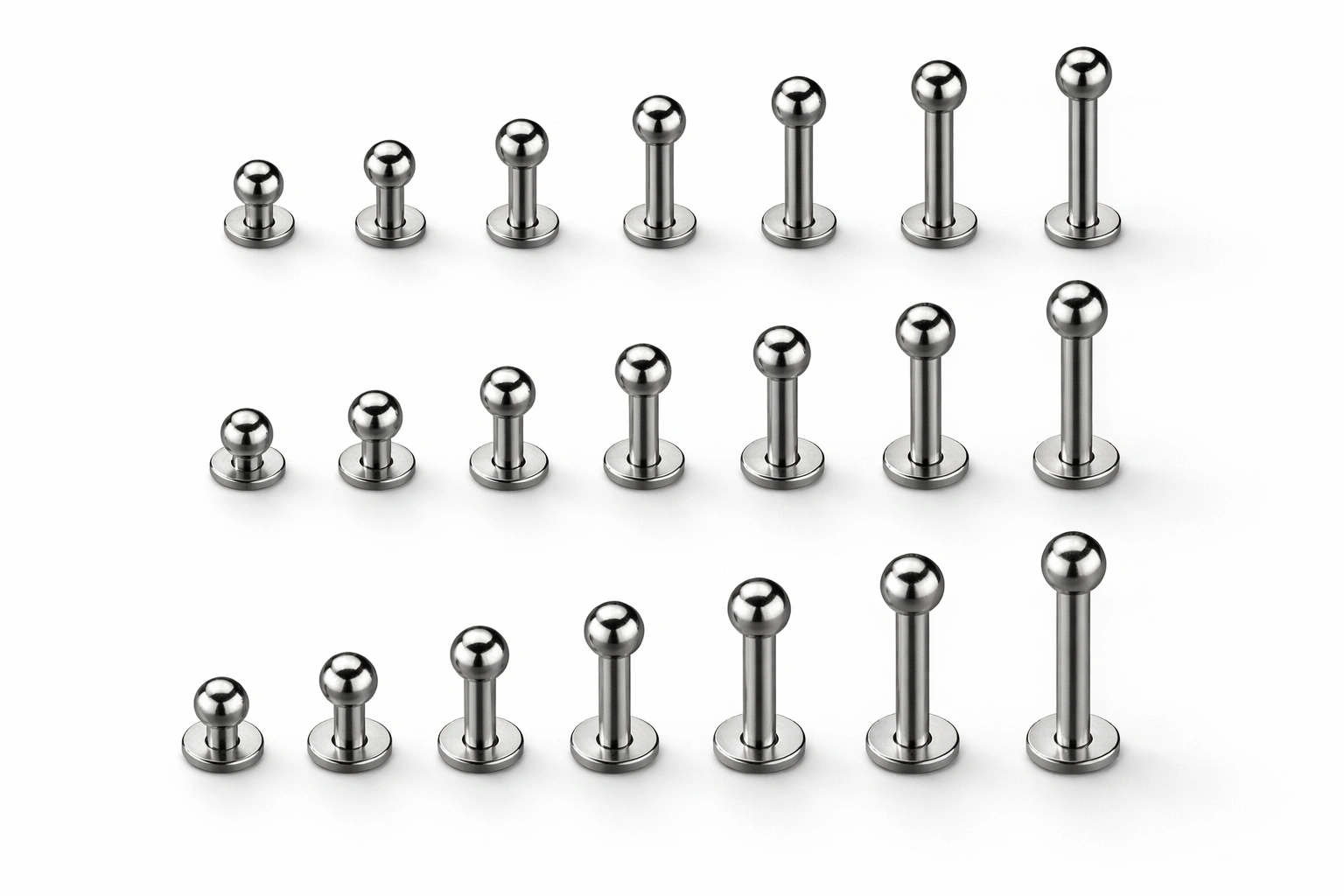 Titanium labret posts arranged by size range and length