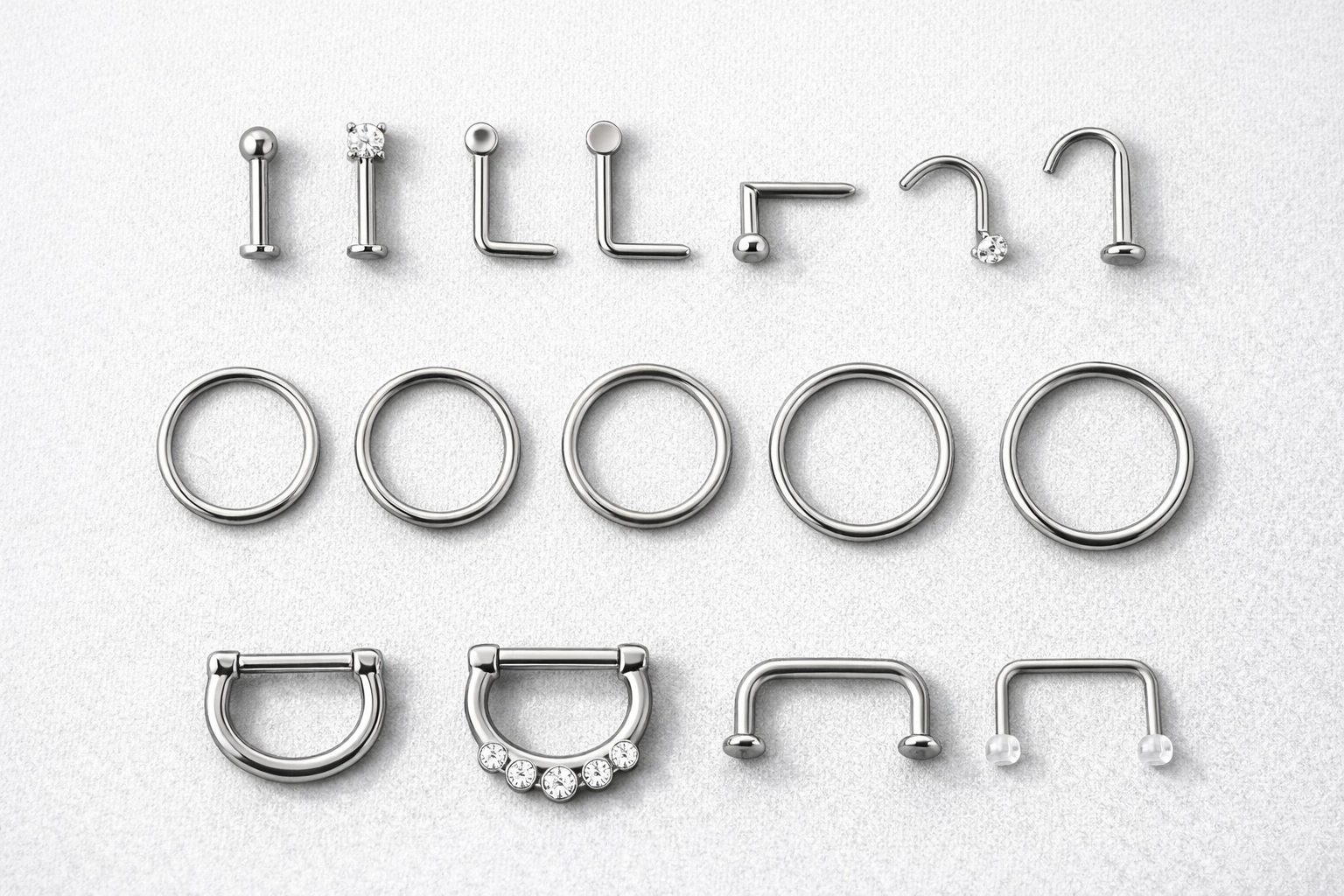Nose and septum jewelry types shown on a clean professional tray
