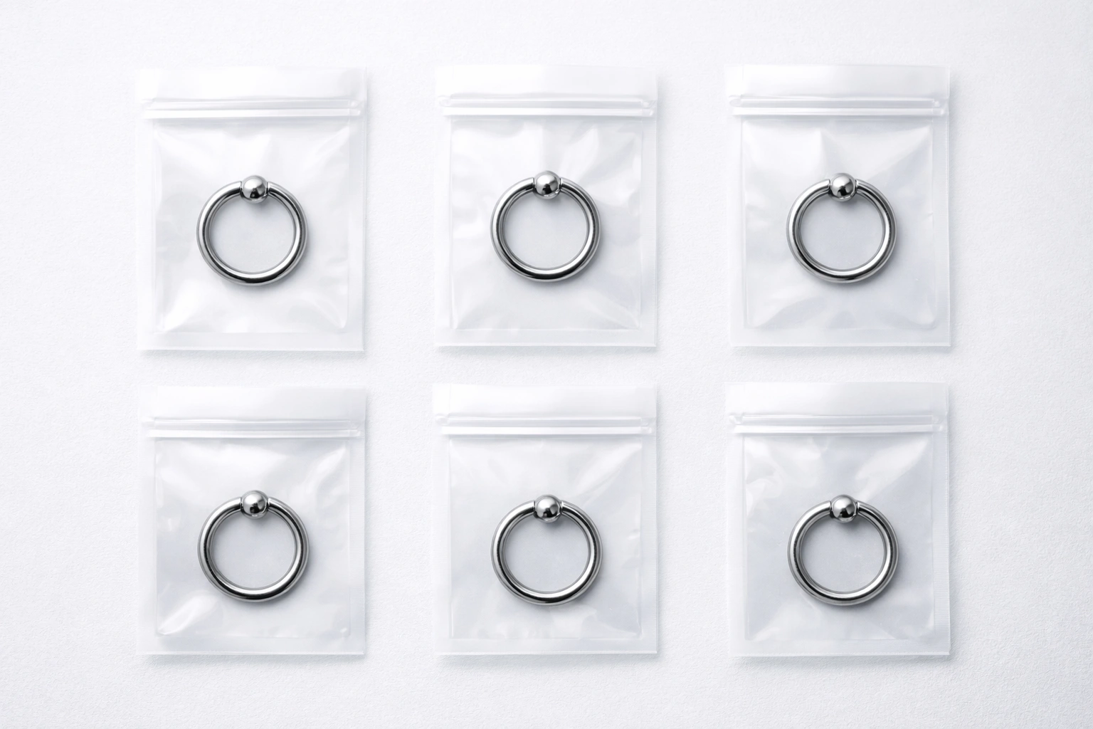 Titanium rings packaged in individual pouches with generic size and batch label