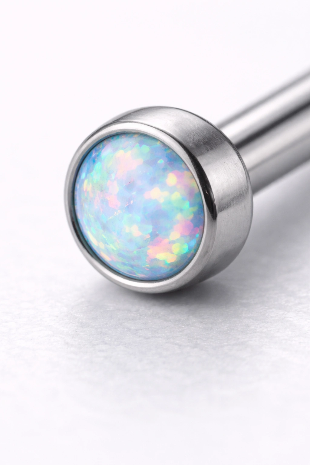 Titanium piercing end with opal gemstone setting