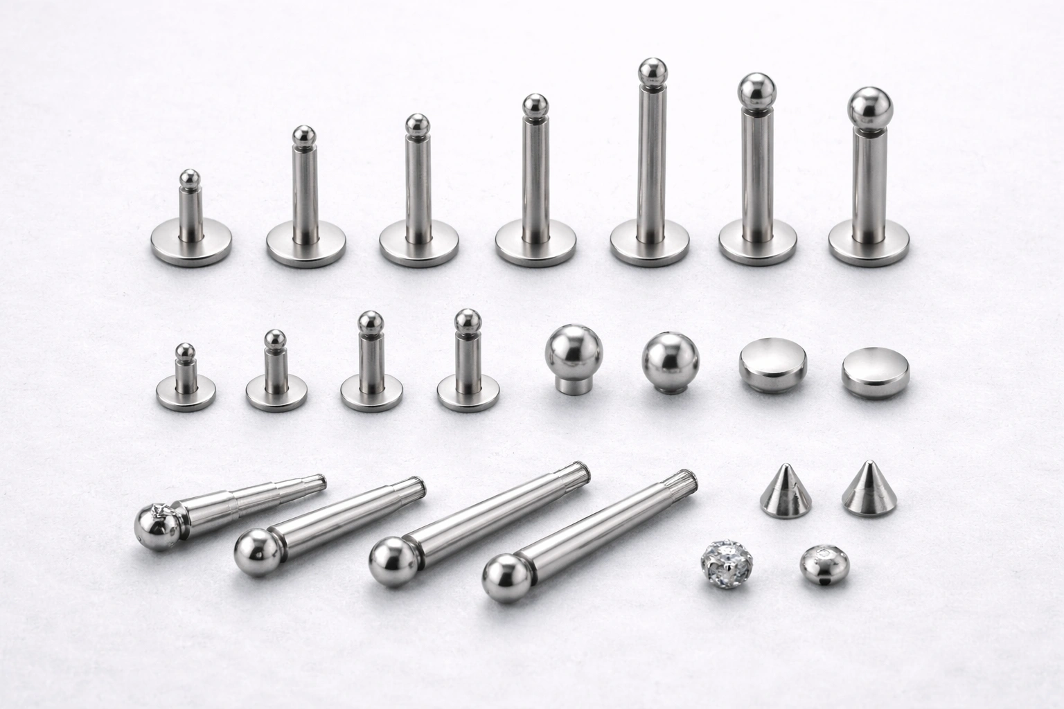 Titanium piercing components showing size and dimension variations